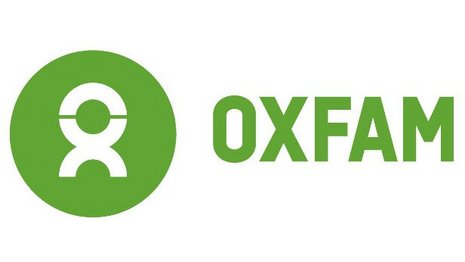 Grünes Logo mit stilisierter Figur in Kreisform, daneben das Wort „OXFAM“ in Grün auf weißem Hintergrund. Symbolisiert soziale Wohlfahrt und Menschenrechtsorganisation. Minimalistisches Design ohne zusätzliche Details.